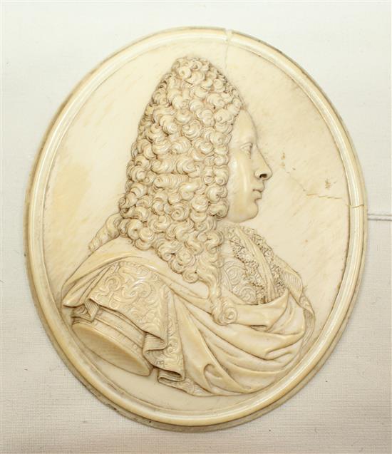 An early to mid 18th century French carved ivory portrait plaque, in the manner of Jean Cavalier, 3.75in., some damage